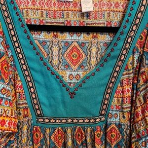 Beautiful tunic like top with lovely embroideries.